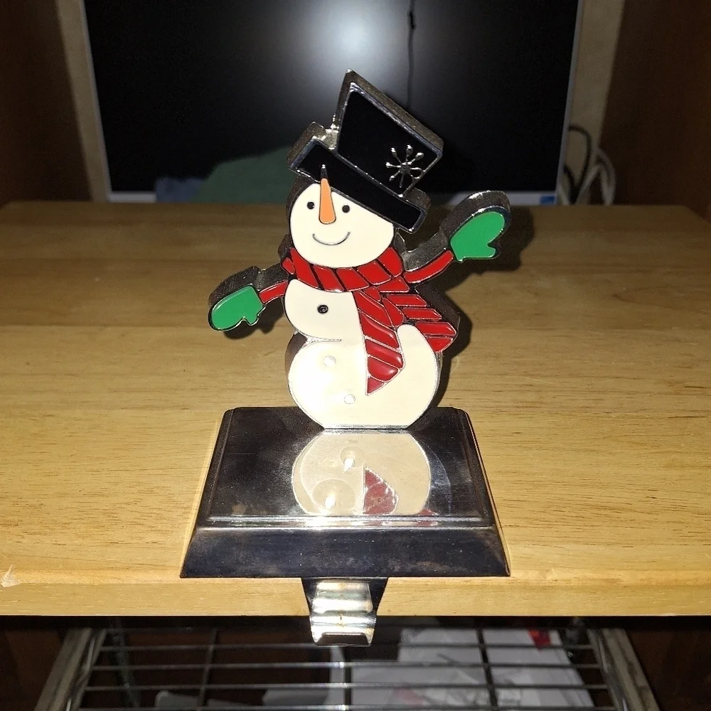 An unbranded Penguin Stocking Holder    It's base is 4